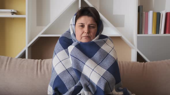 Woman Freezing Feeling Cold at Home. Ill Sick Woman alt