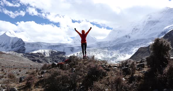 Woman trail runner cross country running in winter nature,slow motion alt
