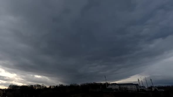 Time lapse: tremendous stormy clouds are moving toward camera view.