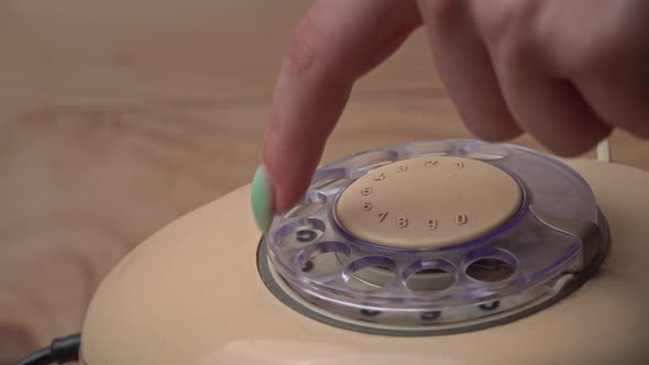 Dialing a Number on an Old Vintage Wire Telephone Making a Call alt