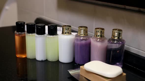 Mini Bottles of Cosmetics on the Table in the Hotel Room