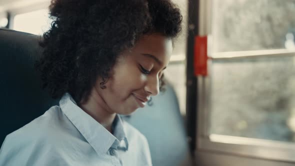 Girl Look Down Talking with Friend Sitting Bus Closeup alt