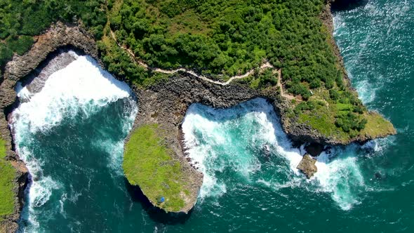 Majestic cliff shoreline of Java, Indonesia, Kesirat Beach aerial top view alt
