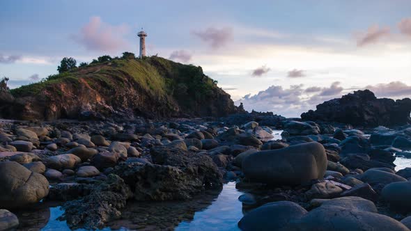 Time Lapse Sunset Over Light House on The Mountain Rock Beach 