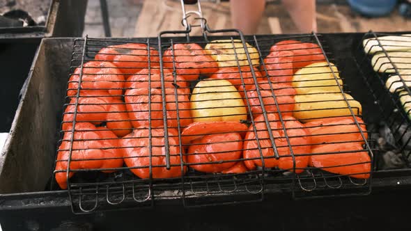 Bell Peppers and Vegetables are Grilled on Grid in Open Barbecue at Food Court alt
