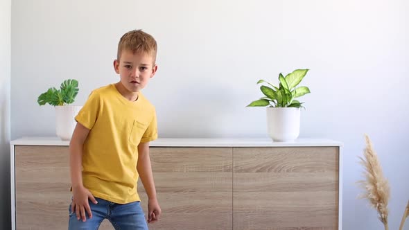 Boy in Yellow Tshirt Dancing and Singing at Home