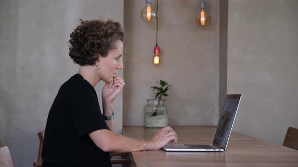 Office Worker Woman Searching Web Online in Modern Coworking Cafe Freelance Jobs in Stasrtup alt