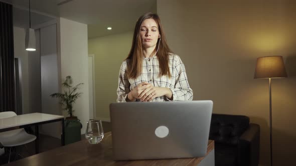 Female Working From Home Having a Video Call with Colleagues