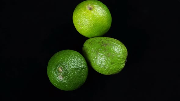 Rotating Exotic Lime Fruit On A Black Background.