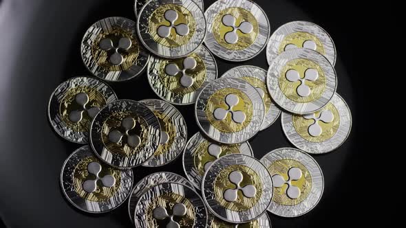 Rotating shot of Bitcoins (digital cryptocurrency) - BITCOIN RIPPLE alt