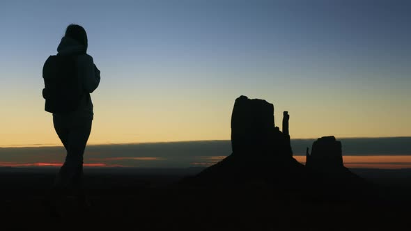 Silhouette of Tourist with Backpack at Cinematic Nature Park Enjoying Sunset alt