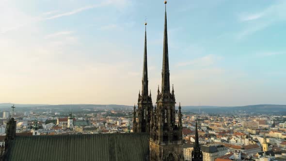Aerial Zoom Shot of Medieval Gothic Towers of Church in Brno, Czech Republic alt