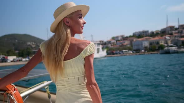 Beautiful Woman on a Yacht Enjoys the Journey Poros Greece Europe alt