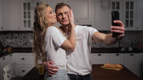 Couple Taking in Selfie in Kitchen