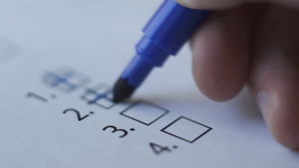 Cropped of Businesswoman Writing on Checklist