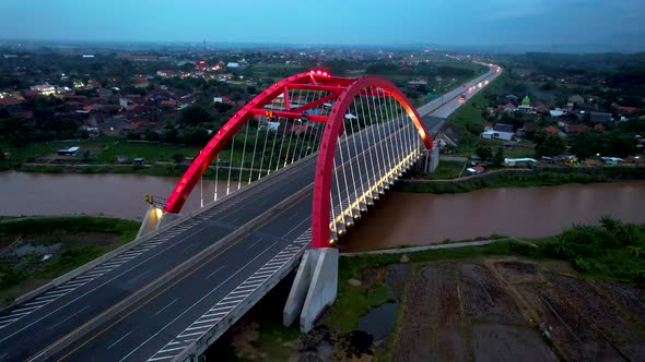Aerial view of the Kalikuto Bridge, an Iconic Red Bridge at Trans Java Toll Road alt