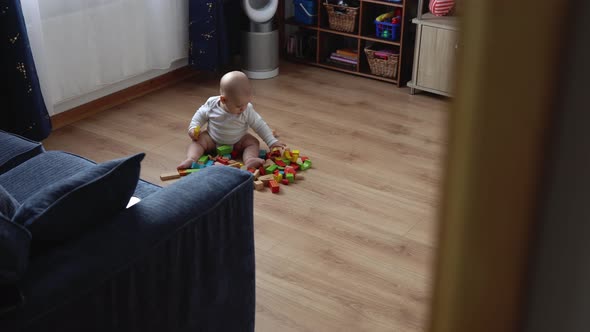 Happy Newborn Baby In Playing Room