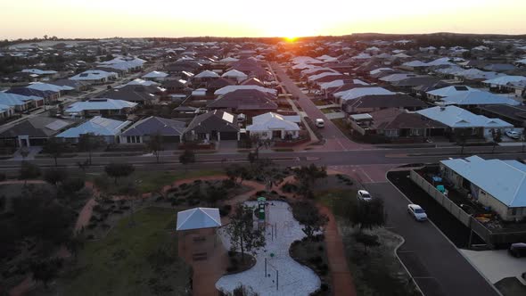 Aerial View of a Suburb with Sunset