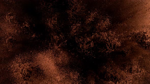 Super Slow Motion Shot of Ground Coffee Explosion on Black Background at 1000Fps alt