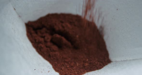 Coffee powder pouring in filter 4k