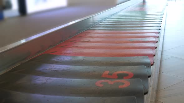 Empty Baggage Claim Line at Airport Terminal alt