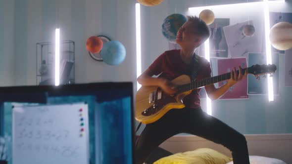 Teenager Pretending to Be Rocker During Online Lesson alt