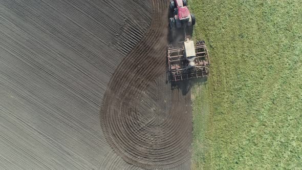 Agriculture, Farm Tractors Plow the Earth in Field, Dust in the Field, View From Height, Grain alt