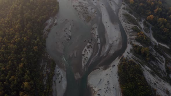 Aerial view Laba river flood, forest at dawn, autumn, natural water earth patterns, Caucasus Russia alt