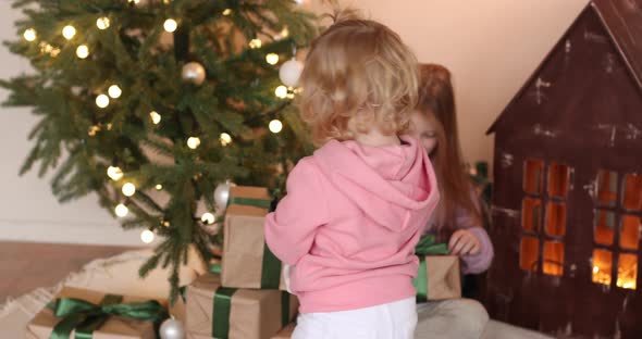 Two Smiling Kids Getting Ready for Christmas Eve