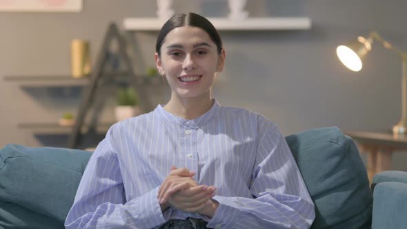 Portrait of Hispanic Woman Talking on Online Video Call alt