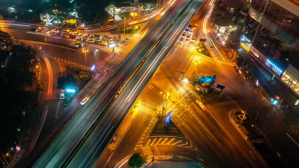 Time Lapse of Busy Highway Road Junction in Metropolis City Center at Night alt