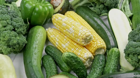 A Tabletop Arrangement of a Variety of Fresh Fruits and Vegetables Sorted By Colors Pepper Corn alt