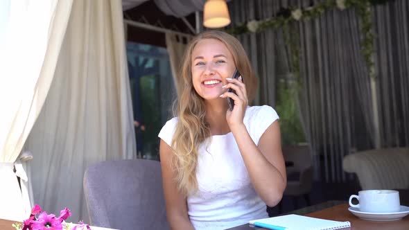 Pretty Young Woman Talking By Phone