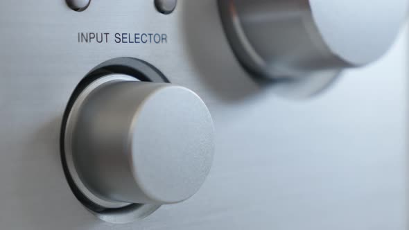 Using dial for input   options on  modern audio device in   aluminum  finish 2160p 30fps UltraHD foo