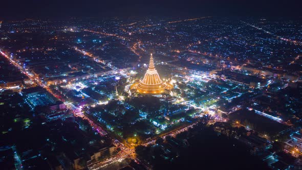 Hyper lapse of aerial top view of Phra Pathommachedi temple at night. Nakorn Pathom,Thailand alt