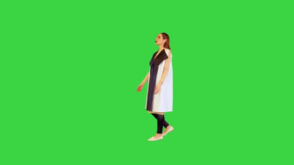Robotic Girl Appears Points to the Side and Goes Away on a Green Screen Chroma Key