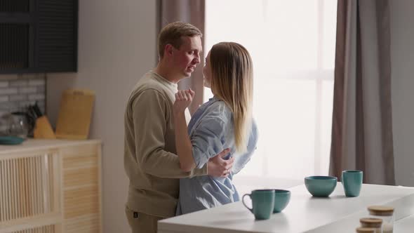 A Young Couple Man and Woman in the Morning Dance Together to the Music alt