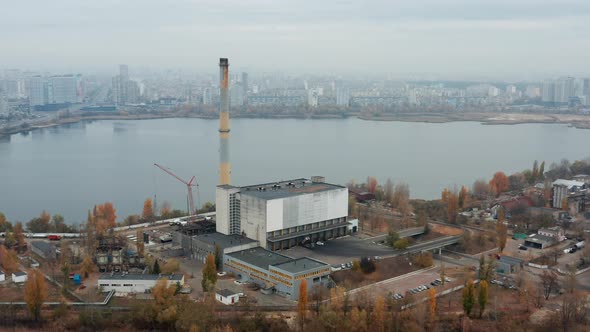 Waste Burning Factory near the City. Flying Around In Smog