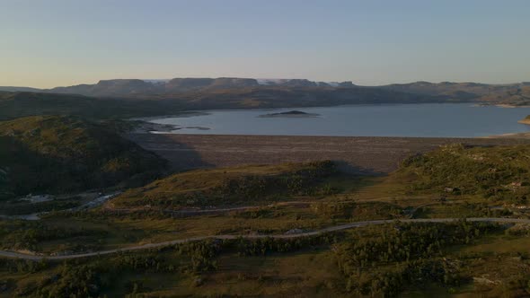 Aerial shot of Sysenvatnet lake and Hardangervidda mountain plateau in Norway alt