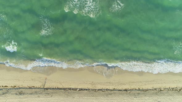 Sea with Waves and Sandy Beach in Sunny Morning alt
