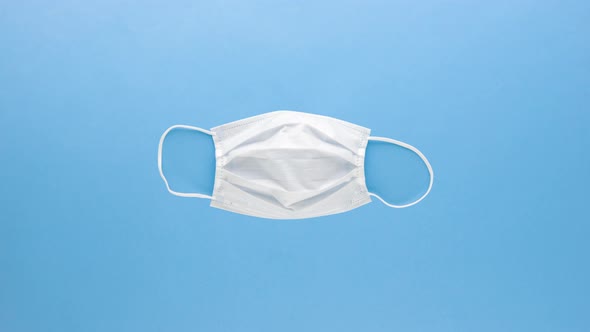 Variety of medical supplies to protect from COVID-19 on light blue background