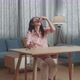 Drunk Asian Woman Pouring Vodka In A Shot Glass And Cheer To Camera Before Drinking At Home - VideoHive Item for Sale