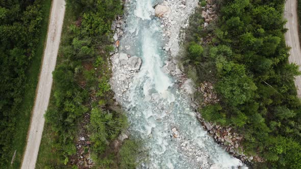 Top View of a Raging Mountain River Flowing at the Foot of the Alps alt