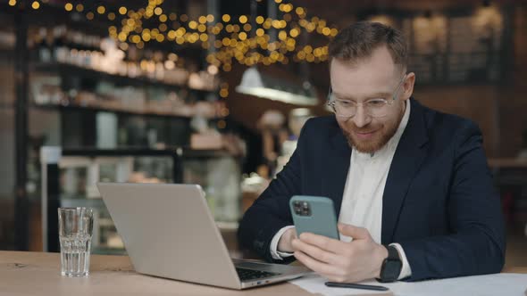 Businessman Texting at the Smartphone alt