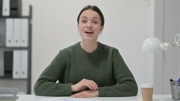 Young Woman Talking on Video Chat alt