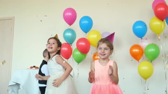 Little Boys and Girls Dance Catching Glitter at Birthday alt