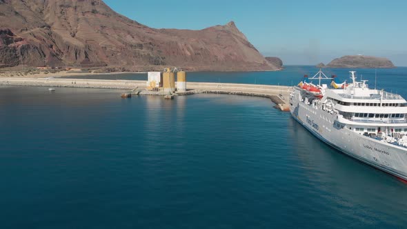 Aerial along anchored crossing islands ferry boat, Portuguese Island alt