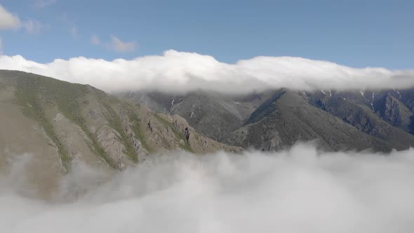 Incredible Aerial Flight Through Clouds Fog to Majestic Epic Dark Mountains