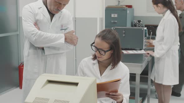 Scientist standing in the laboratory and giving a speech