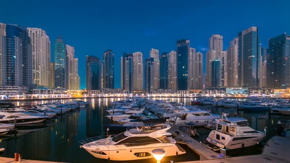 Dubai Marina at Blue Hour Night to Day Timelapse with Yachts alt